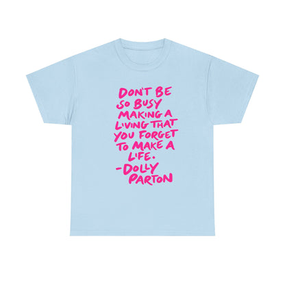 Dolly Parton Quote Tee — "Don't Be So Busy Making a Living" Pink Handwritten Graphic T-Shirt